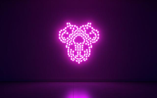 Vibrant, illuminated LED neon art piece on a dark wall